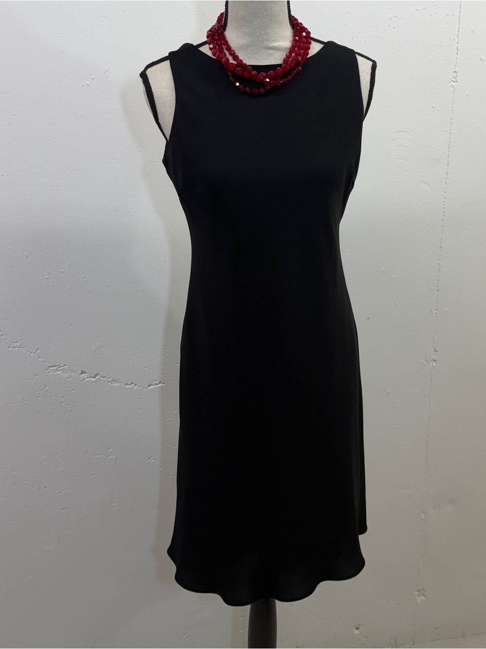 Classic Black Sleeveless Shift Dress with a cute criss cross effect on the back